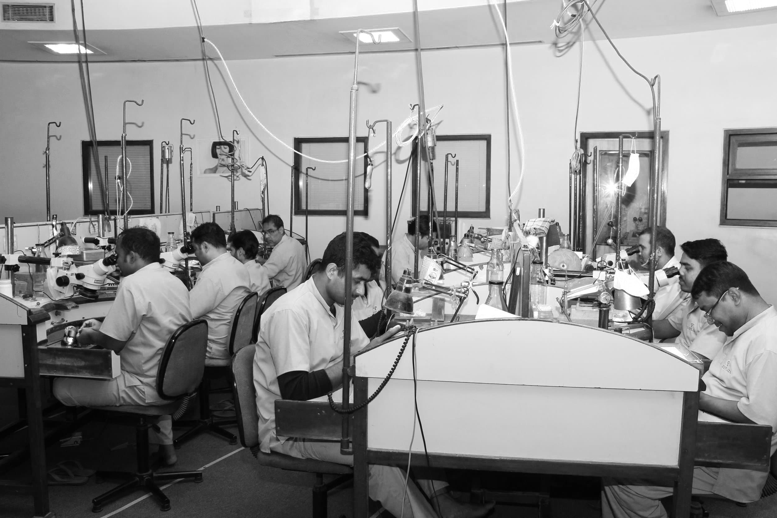 Craft hands working at the Gem Plaza atelier bench