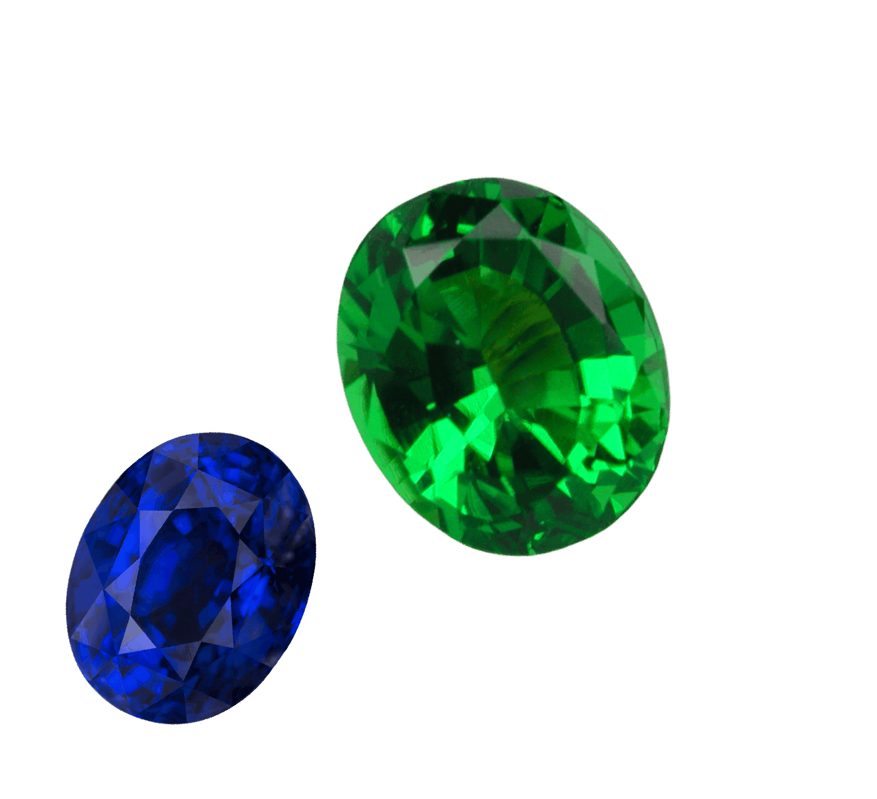 A loose sapphire and a loose green garnet, cut and ready for setting